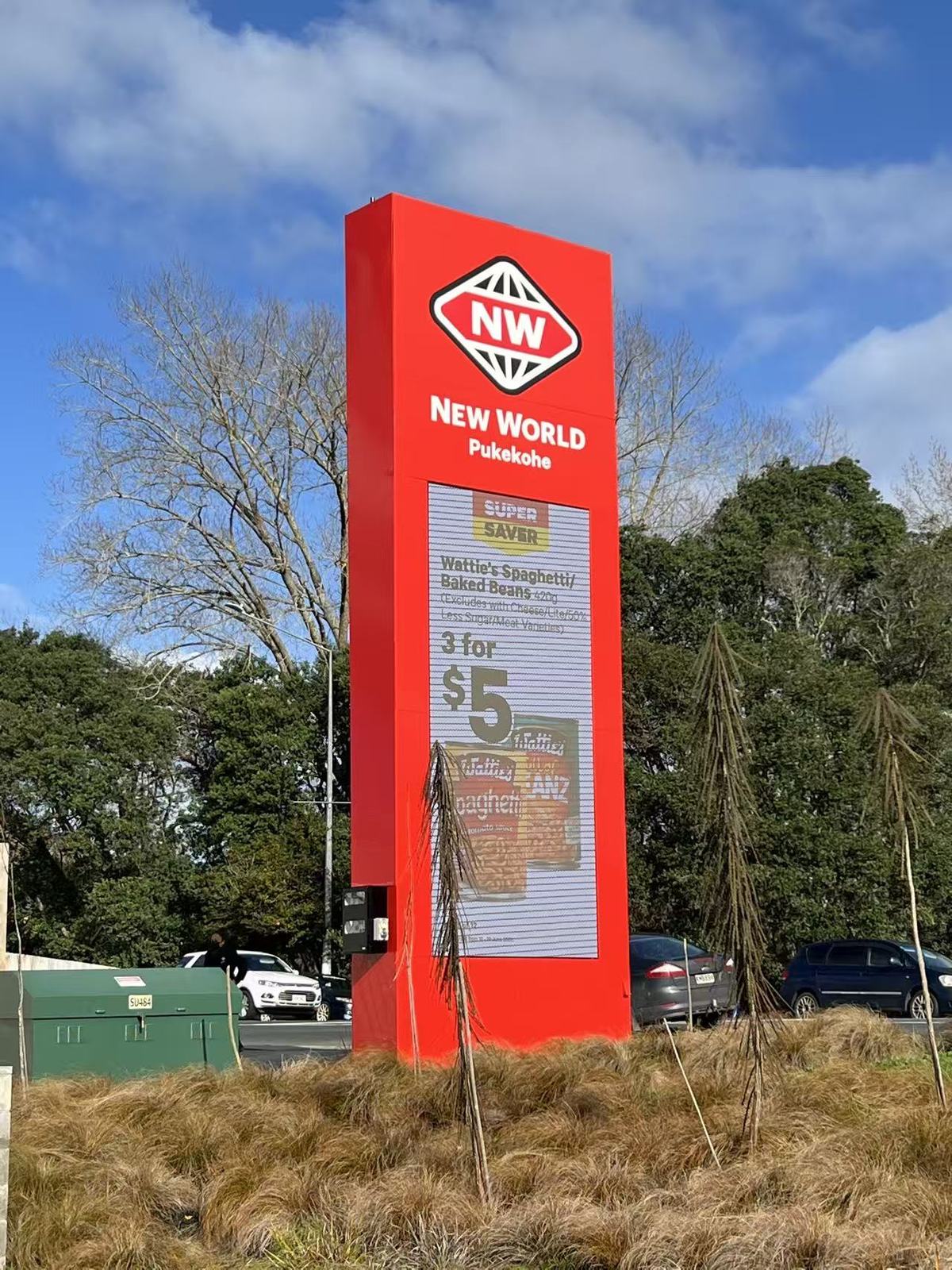 New World outdoor LED display on red roadside pylon sign