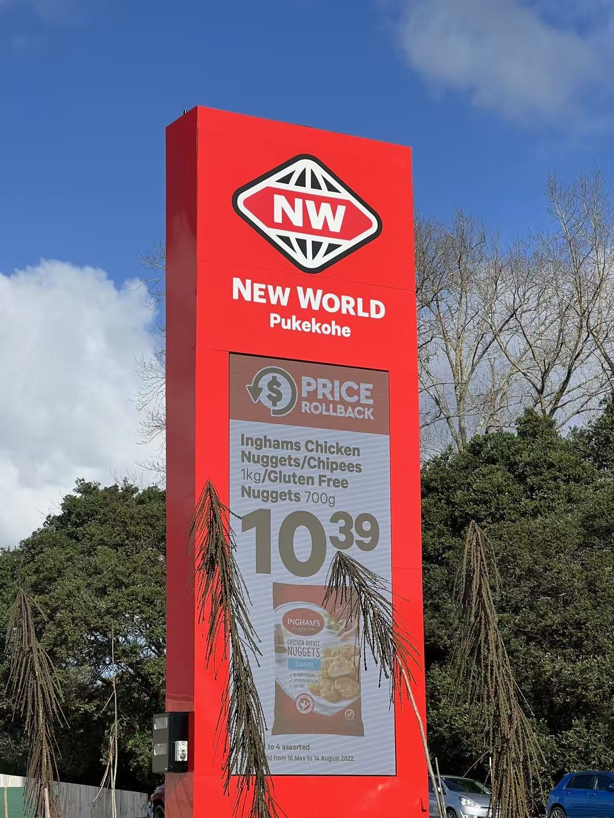 New World outdoor LED display showing price rollback promotion