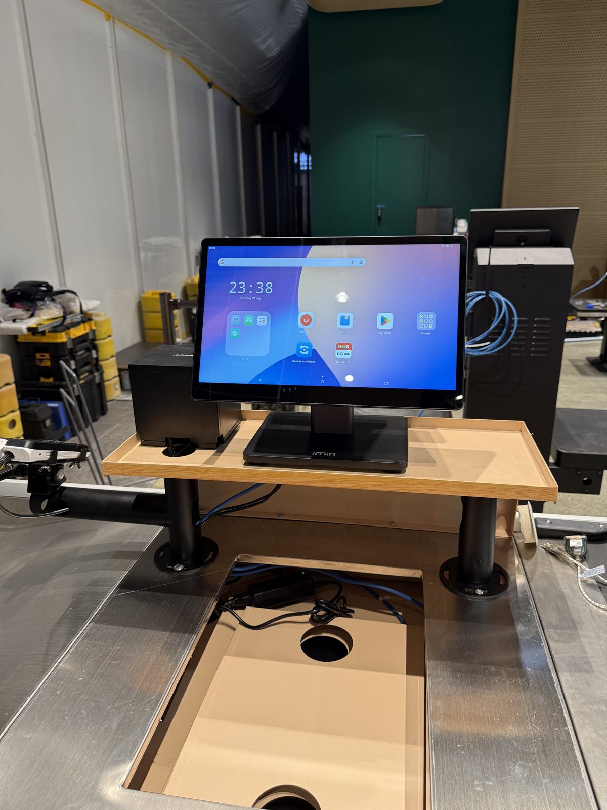 POS touch screen and receipt printer being installed