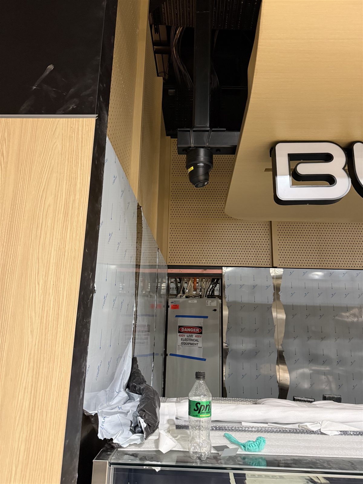 CCTV camera positioned into shopfront ceiling details