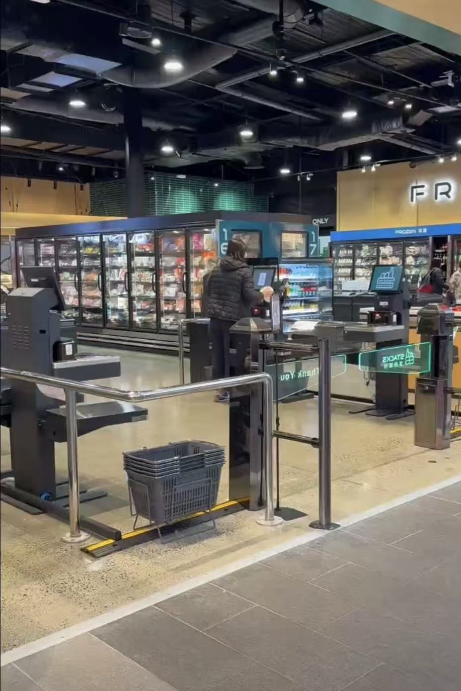 Self checkout lanes in supermarket checkout area